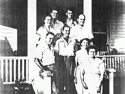 Back Row L to R:  Melba, Dallas Kemp, Larry and Troy Sheldon.  Front Row L to R:  Zini, Stanley Russell, Janis and Lola Wahab.  This family photo was taken on the front porch of the home sometime before 1970.